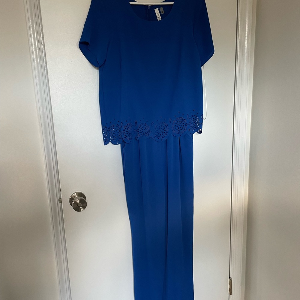 Blue jumpsuit. Wide leg pant with doiley detail.